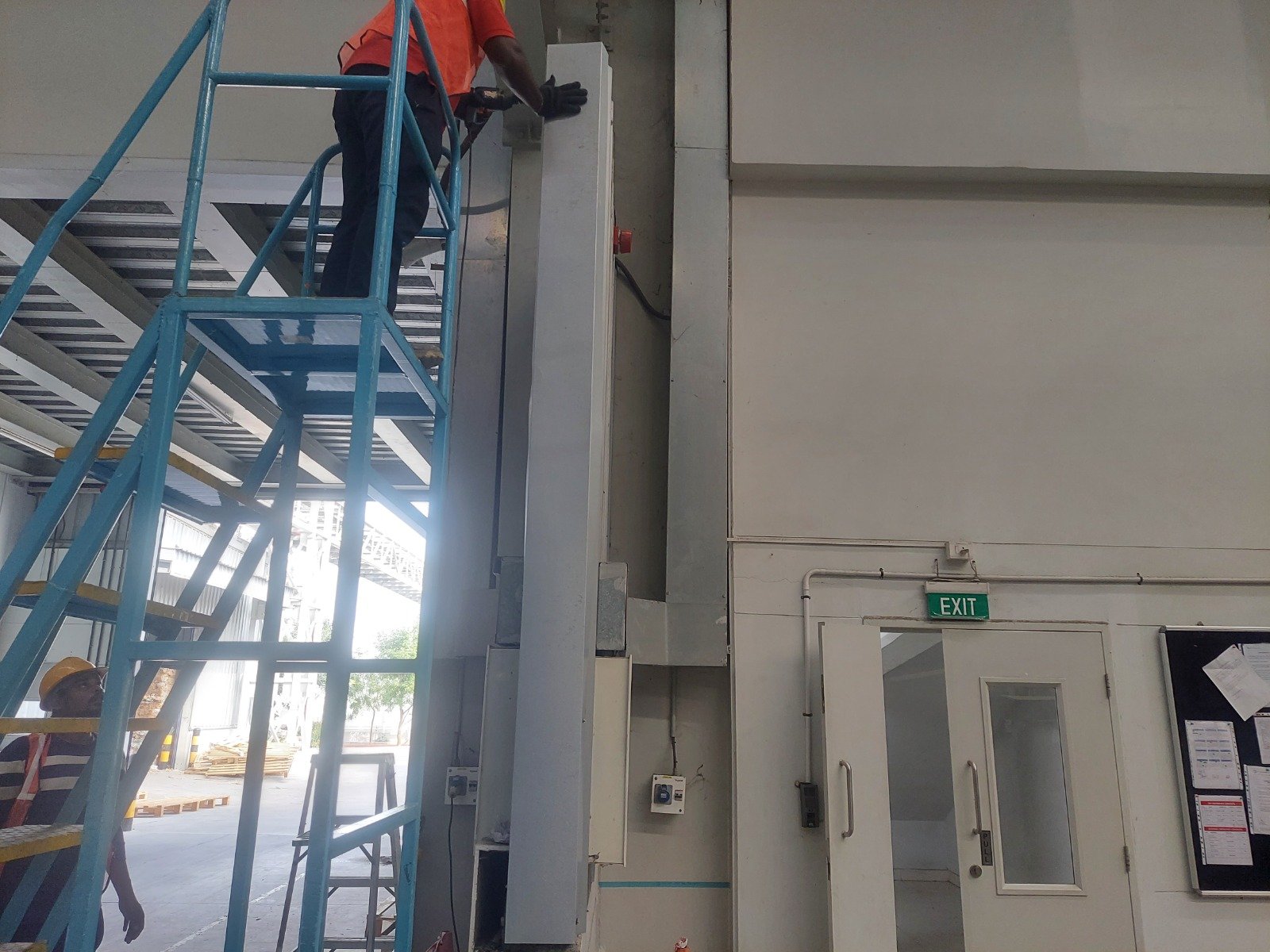 Industrial HVAC duct installation inside a warehouse building