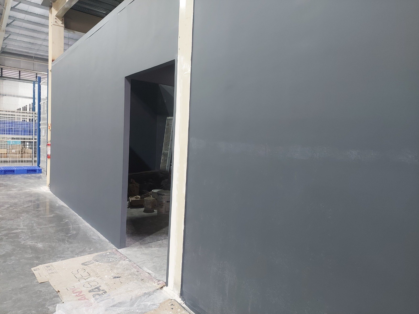 Finished interior partition wall in an industrial facility