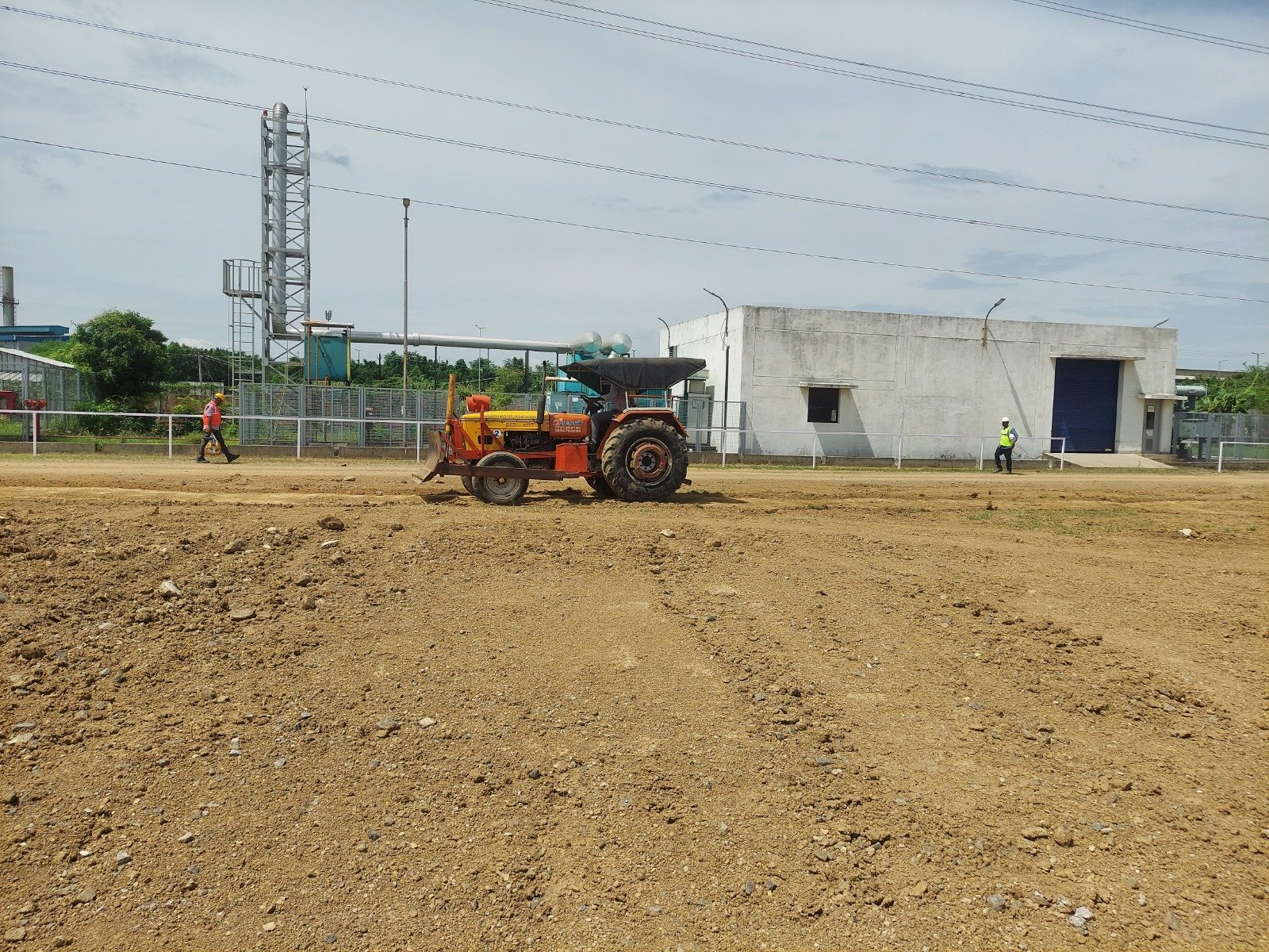 Tractor dozer grading an industrial site to formation level