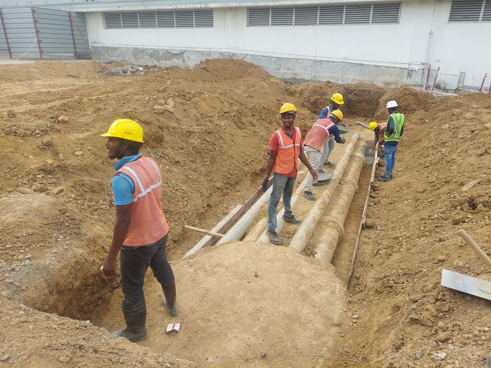Industrial RCC pipe laying in an open drainage trench