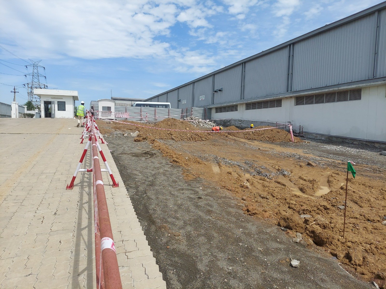 Utility trenching and walkway construction across the industrial site